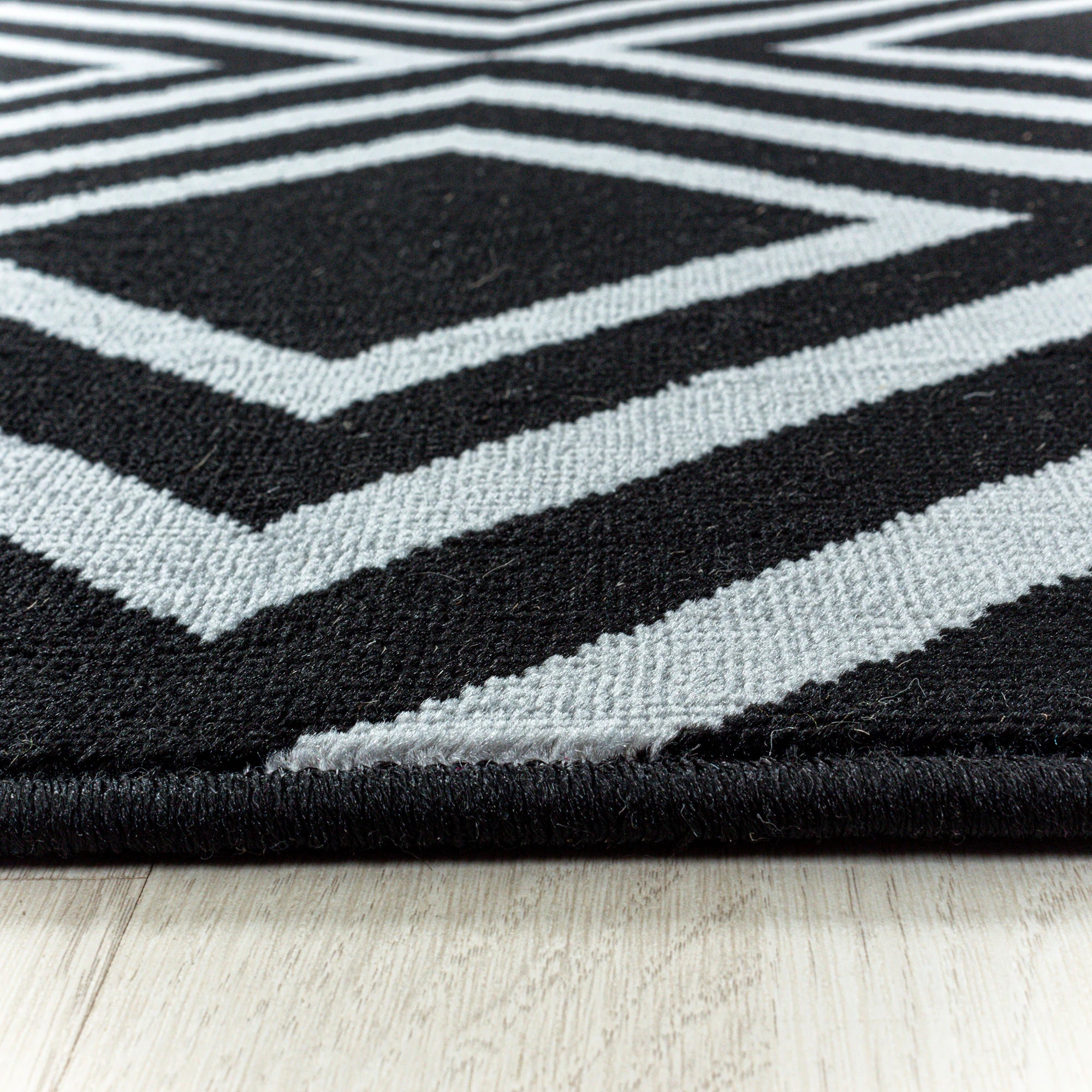 Geometric Repeating Diamond Pattern Rug - Black