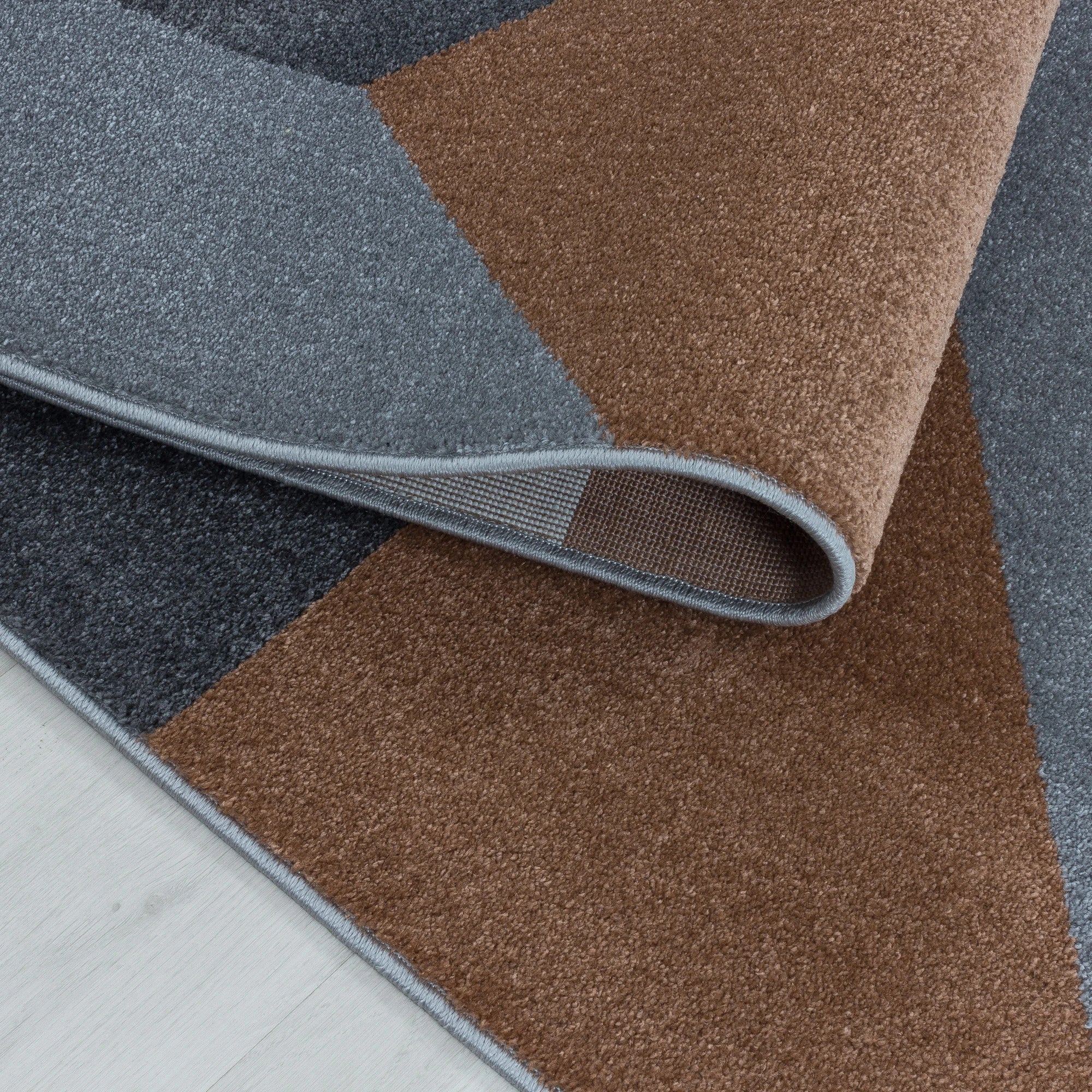 Modern Geometric Triangle Patchwork Area Rug | Copper