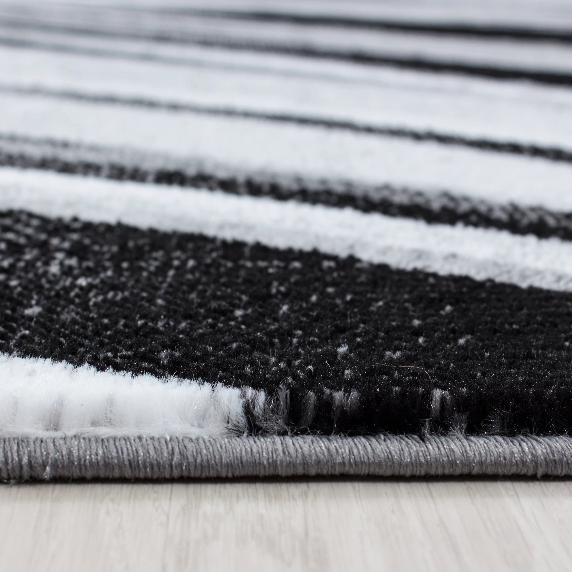 Modern Abstract Wavy Line Area Rug | Black