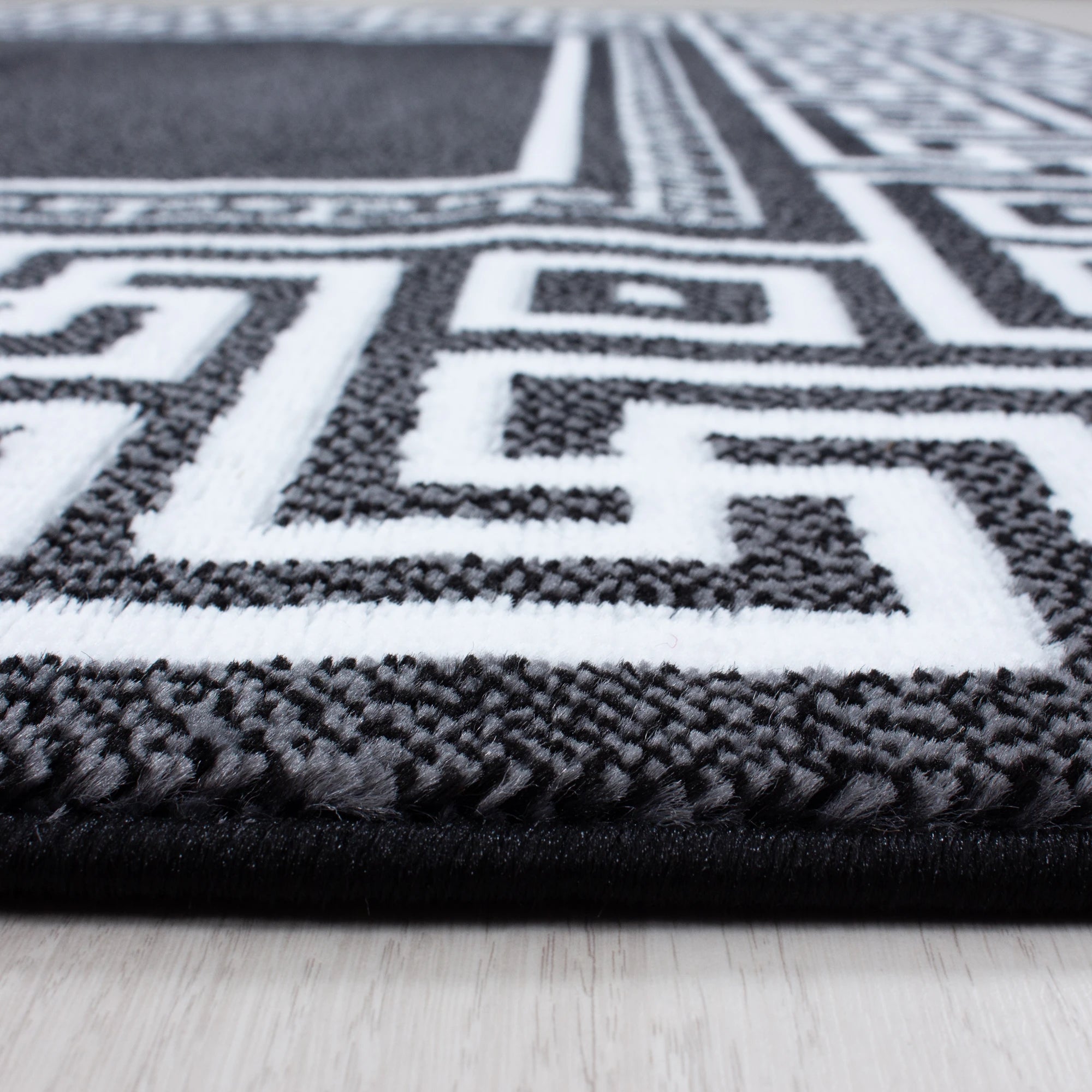 Modern Meander Border Area Rug | Black