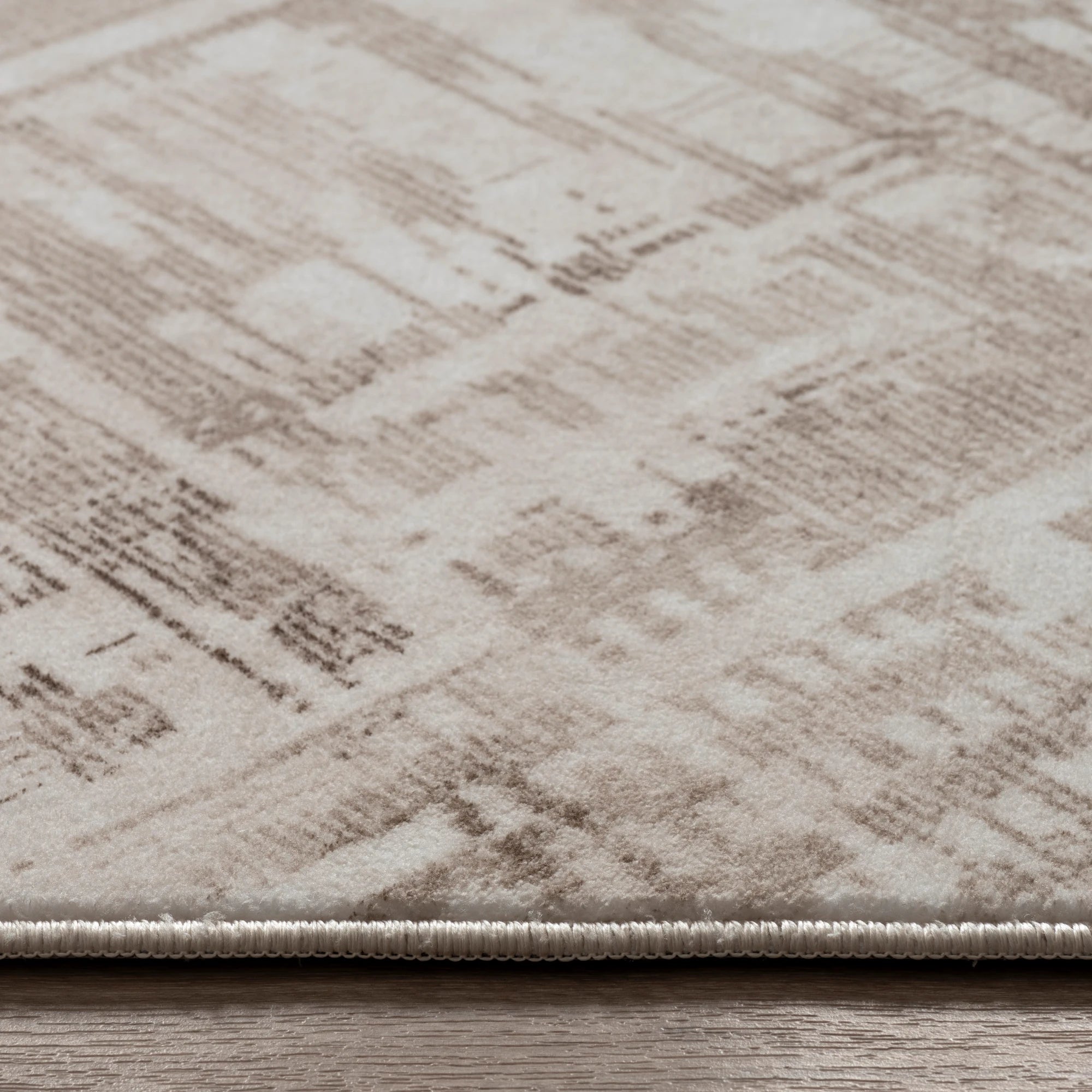 Beige Rug with a Distressed Patchwork Effect