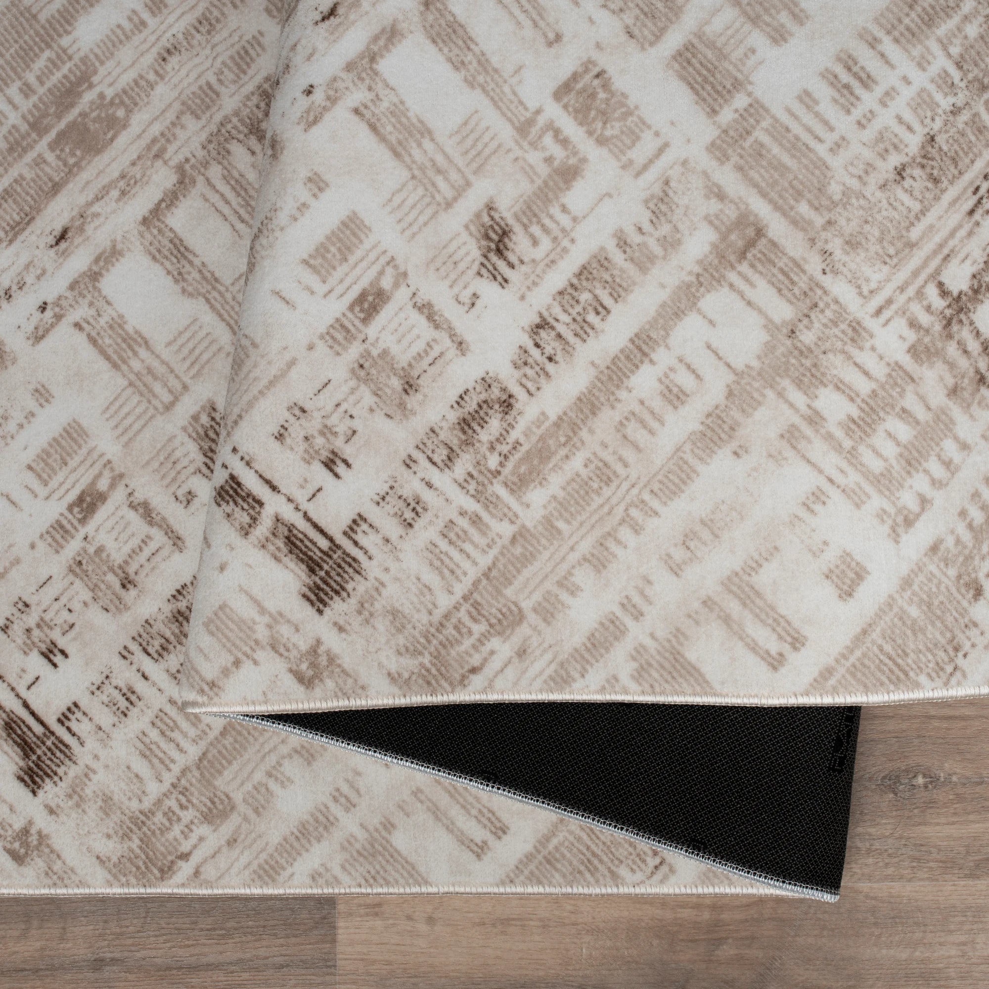 Beige Rug with a Distressed Patchwork Effect