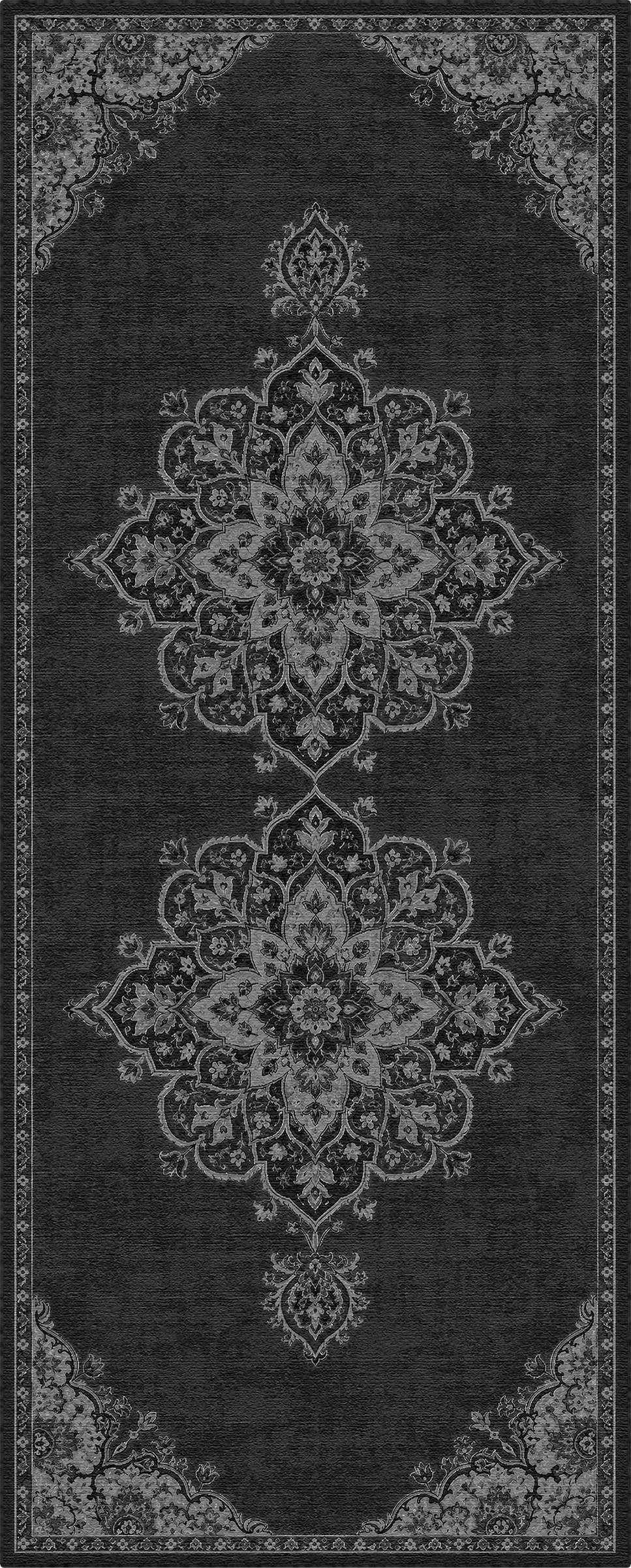 Un tappeto per area grigio antracite scuro con un motivo tradizionale in stile vintage dall’aspetto vissuto, nei toni del grigio chiaro e del bianco, caratterizzato da due grandi medaglioni centrali e dettagli decorati agli angoli.