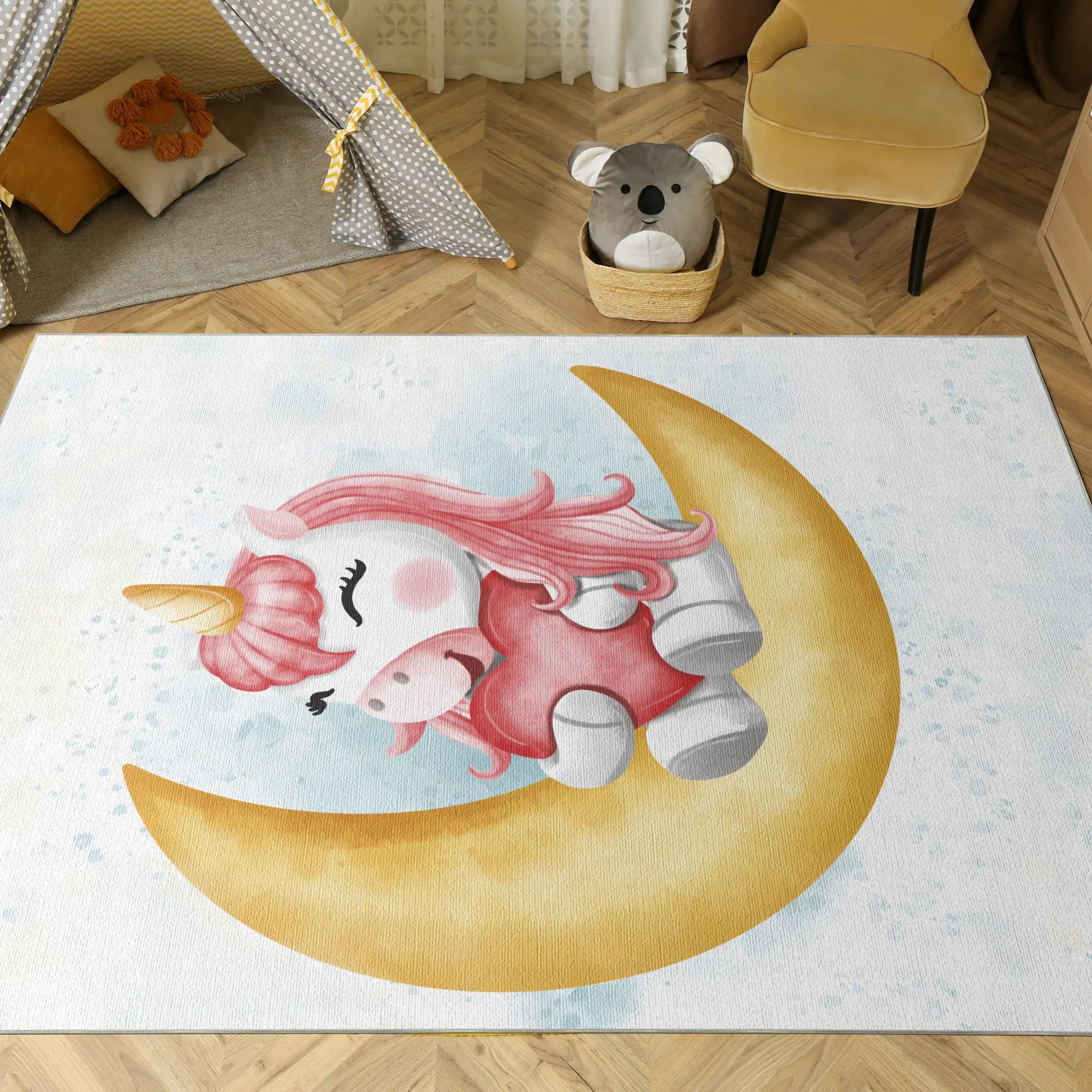 Children's rug with a unicorn and piglet design on a crescent moon, placed in a room with toys and furniture.