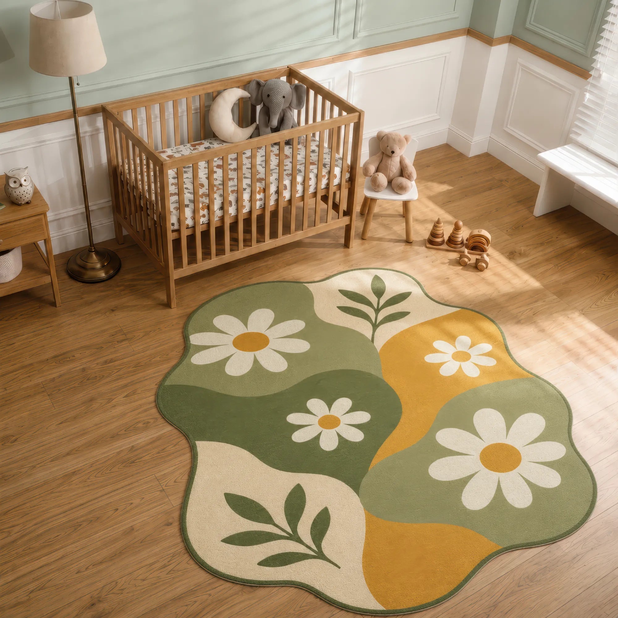 A scalloped area rug with a daisy and leaf pattern in sage green, mustard yellow, cream, and white, styled in a nursery next to a wooden crib.