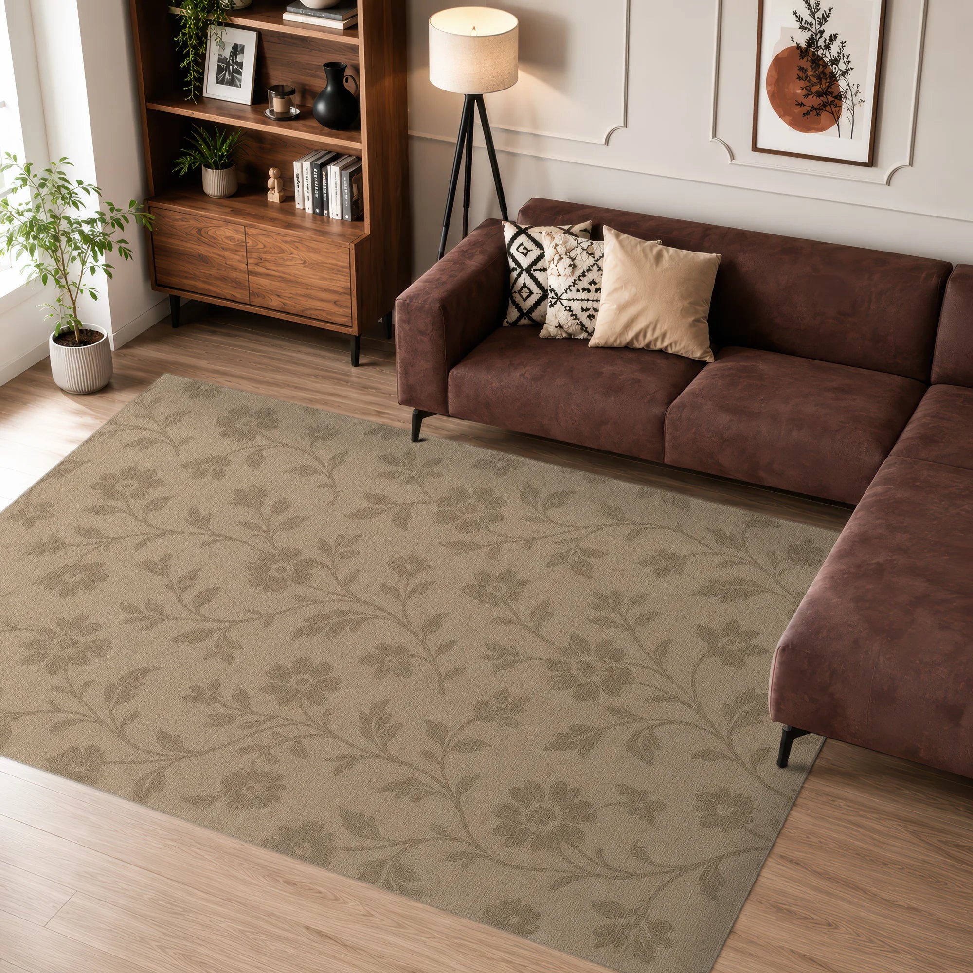 Living room with a brown sofa, patterned rug, and wooden bookshelf.