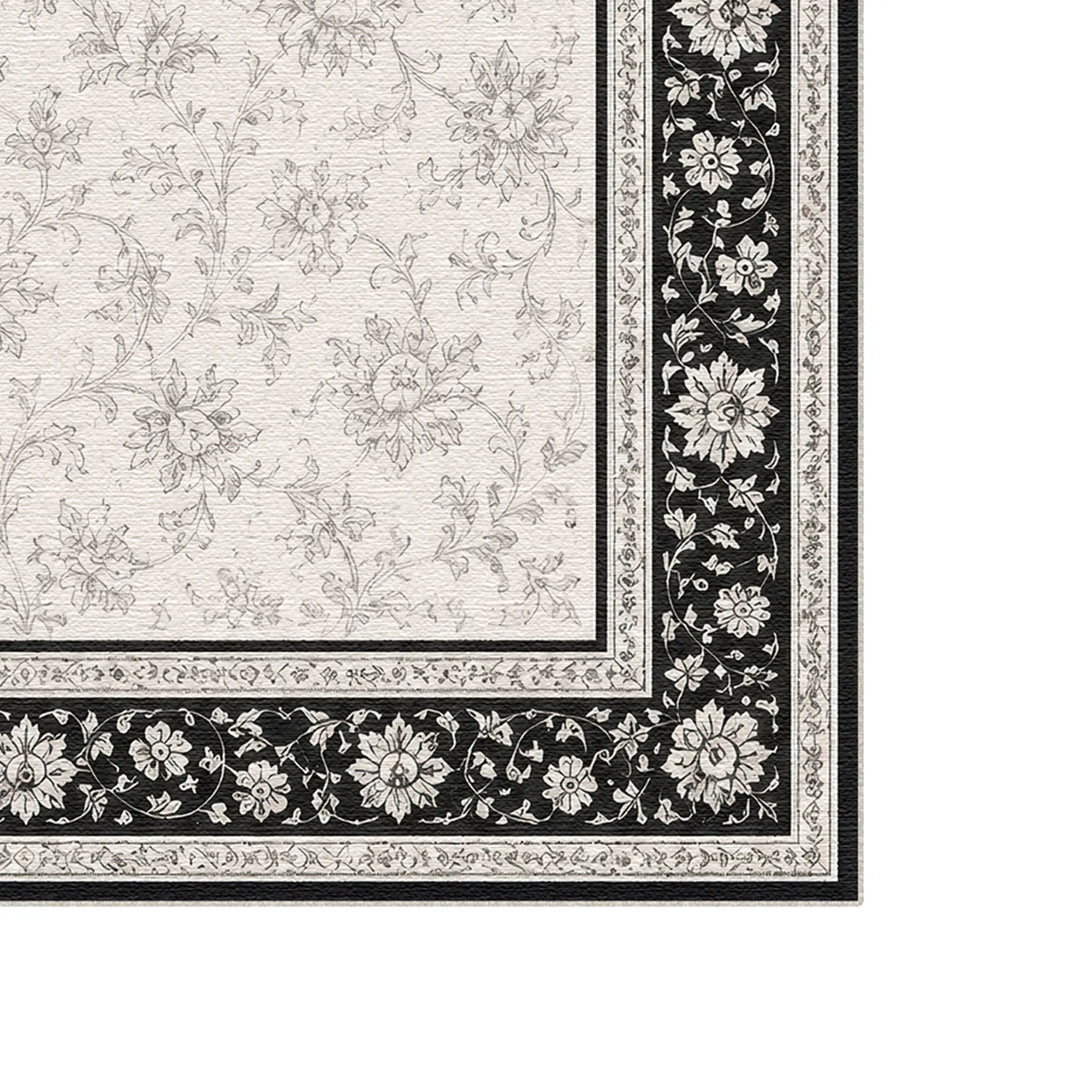 Tappeto con bordo floreale in bianco e nero