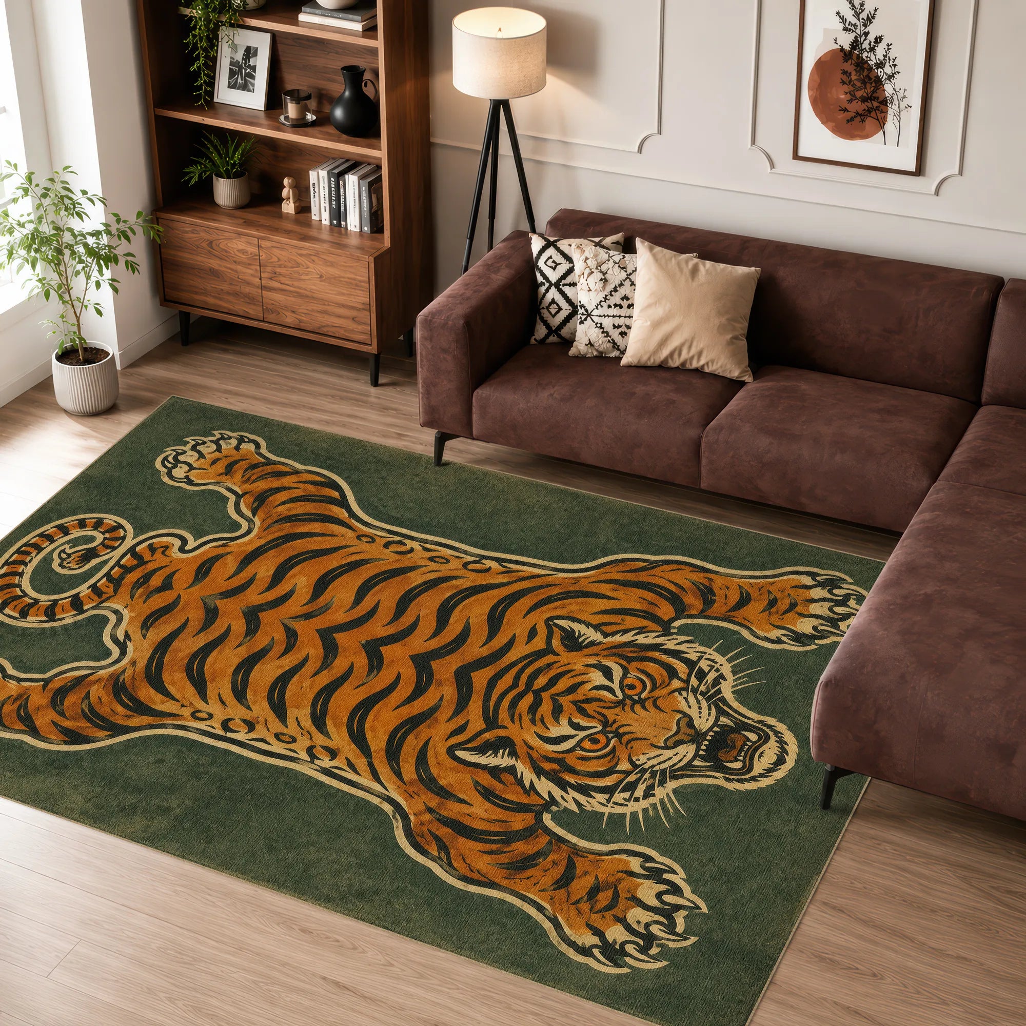 A large rectangular tiger area rug featuring a detailed tiger print in orange, black, and cream, styled in a modern living room setting on a light wood floor next to a brown sectional sofa.